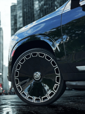 side view of Giovanna Dicotto black machine wheel installed on Escalade